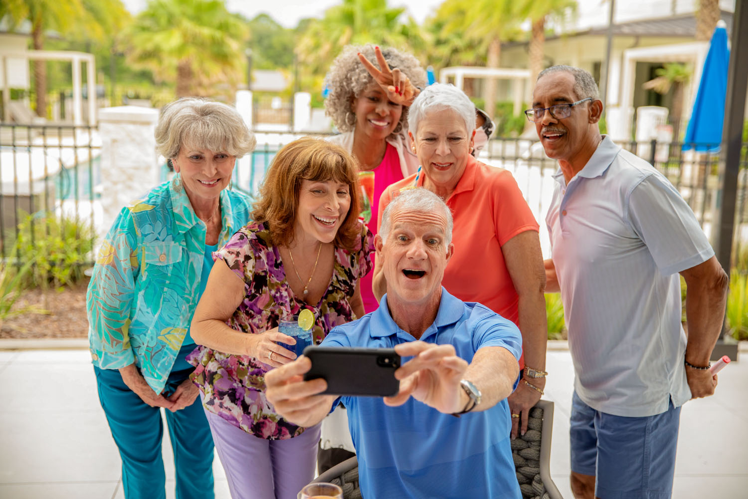 Group of residents taking selfie on the patio