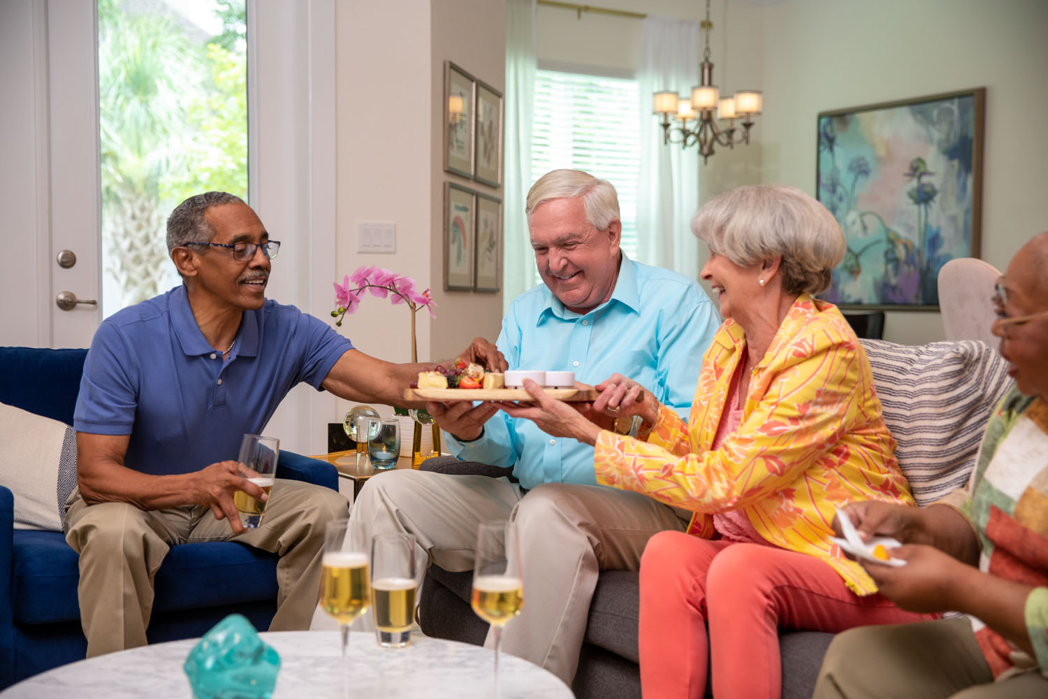 Residents in apartment passing appetizer plate