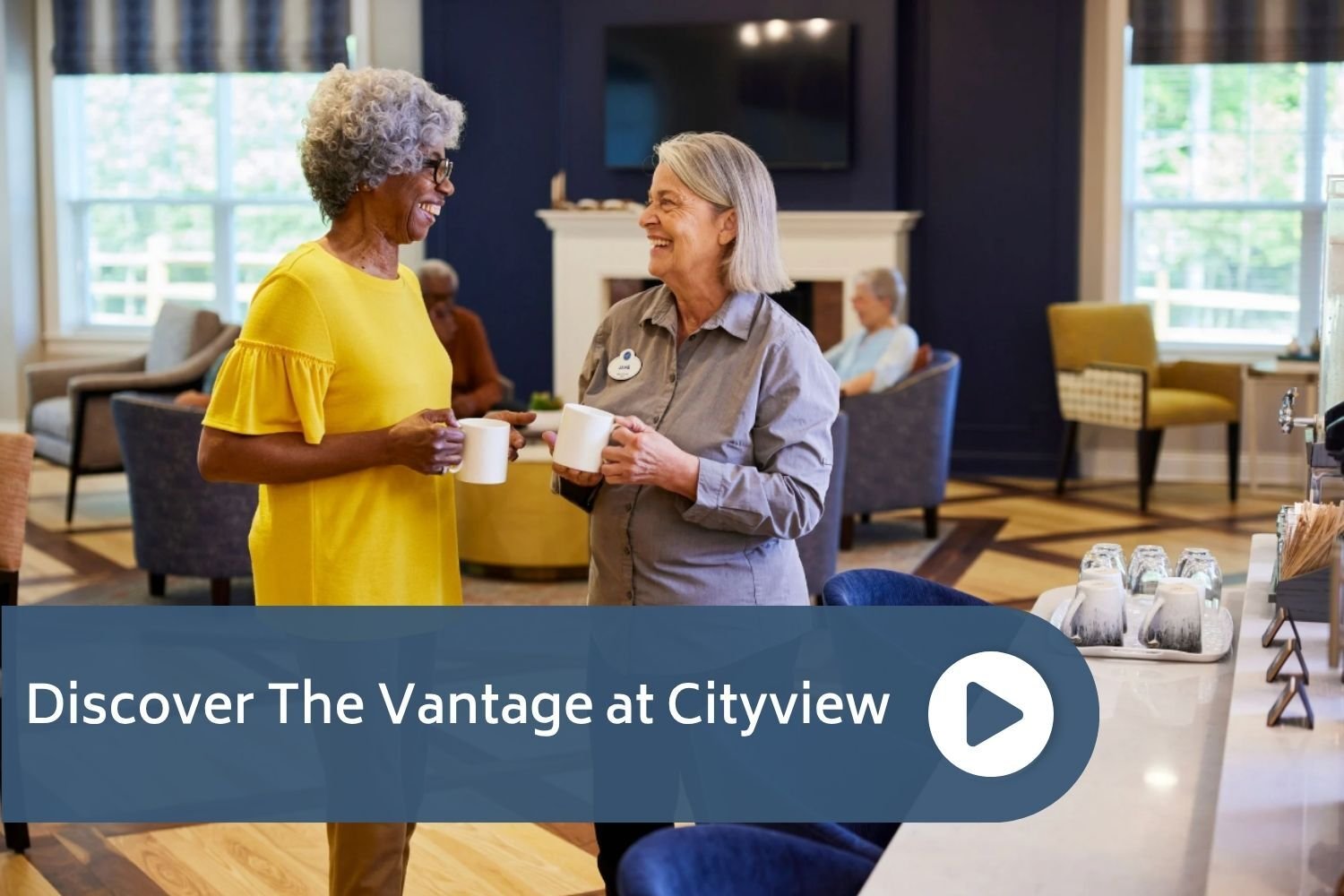 Two women chatting holding coffee cups