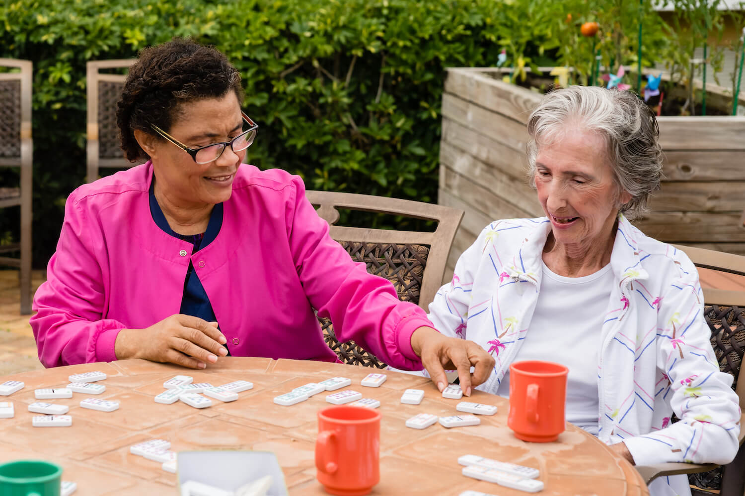 Resident and Staff Playing Game